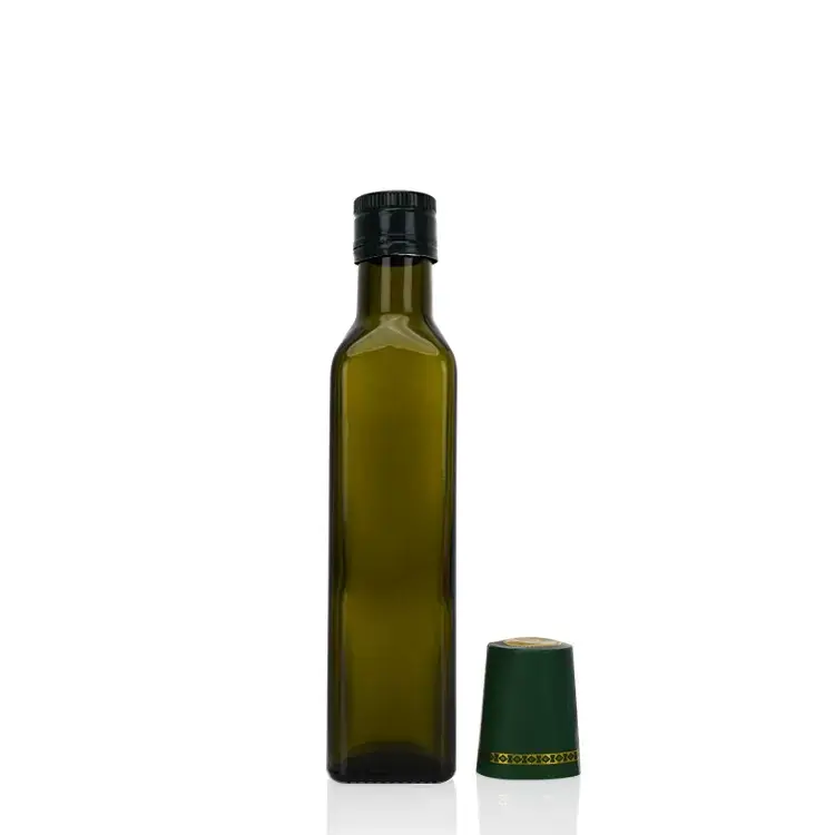 A square emerald green olive oil bottle is a great helper for kitchen storage.