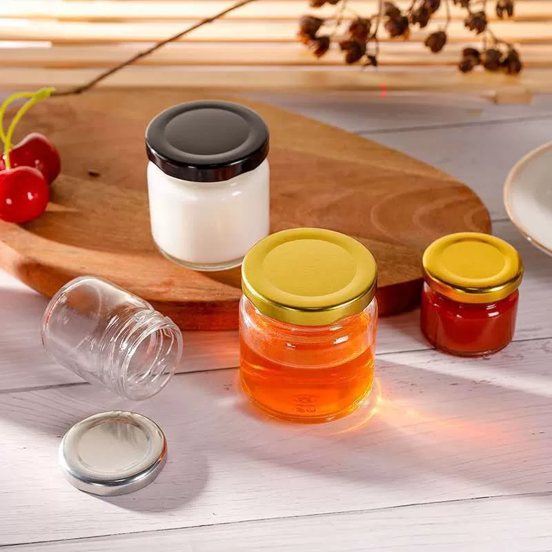 China 25ml Round Mini Honey Jam Glass Jar with Metal Lid Factory & Wholesaler | Glint Featured Image